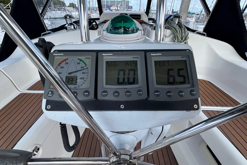 Slide: The Image of Cockpit of 2006 Hunter 38 sailboat with Raymarine instruments and compass. - 18