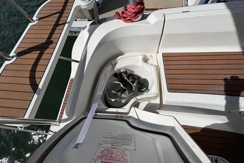 Slide: The Image of Hunter 38 sailboat deck with open storage compartment, 2006 model. - 25