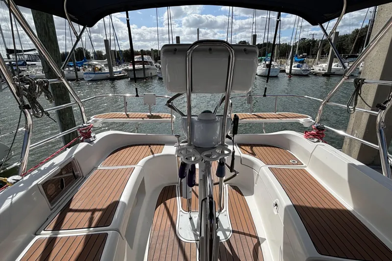 Slide: The Image of Cockpit of 2006 Hunter 38 sailboat with wooden deck, docked at marina. - 28