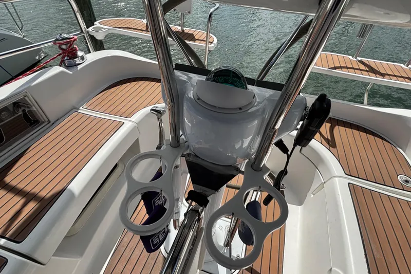 Slide: The Image of Cockpit of 2006 Hunter 38 sailboat with teak flooring and steering wheel. - 29