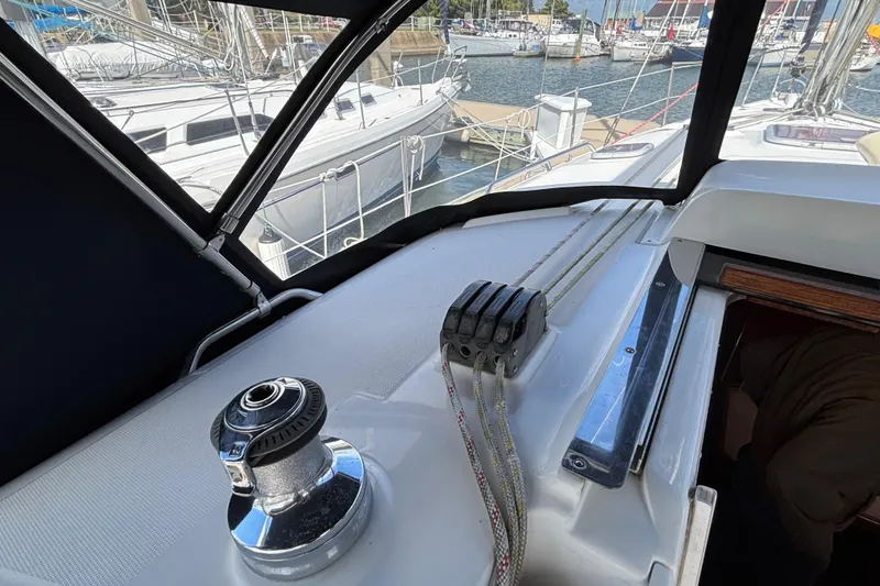 Slide: The Image of Cockpit view of 2006 Hunter 38 sailboat with winch and ropes in marina. - 31