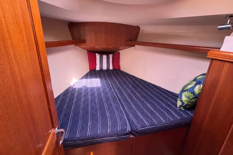 Slide: The Image of Cozy cabin interior of 2006 Hunter 38 sailboat with comfortable bedding and pillows. - 59