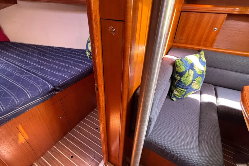 Slide: The Image of Interior of 2006 Hunter 38 yacht with cozy cabin and seating area. - 62