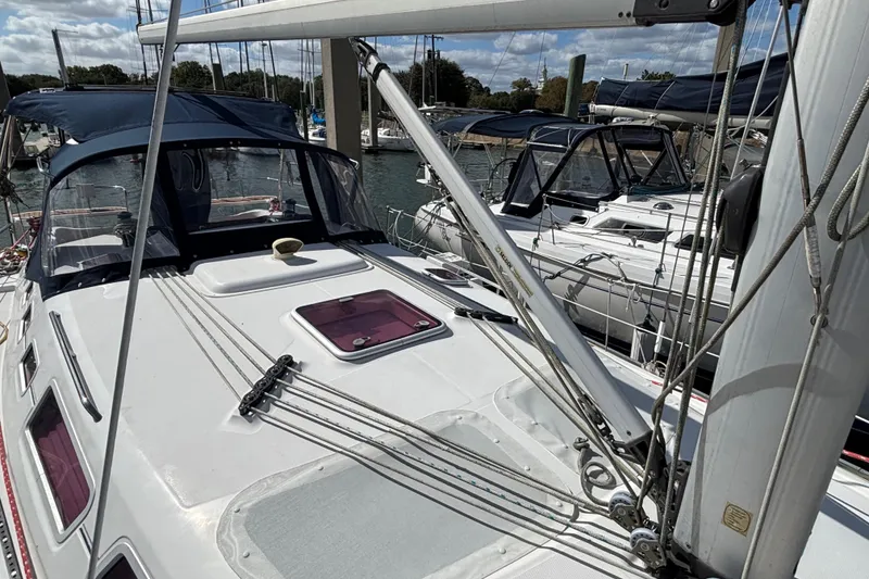 Slide: The Image of Sailboat Hunter 38, 2006 model, docked at marina with clear skies. - 9