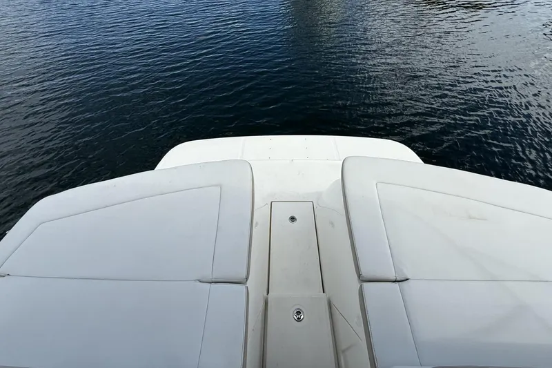 Slide: The Image of 2015 Sea Ray 370 Venture boat deck overlooking calm water. - 10