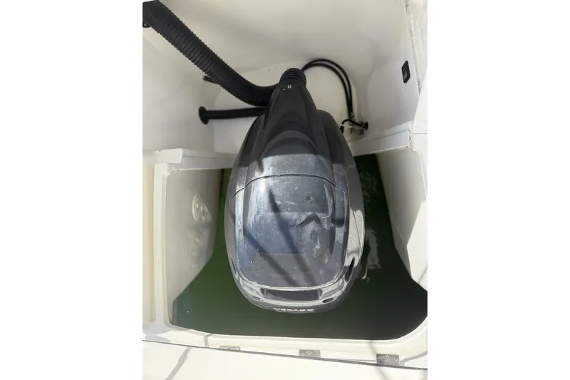 Slide: The Image of 2015 Sea Ray 370 Venture engine compartment with visible outboard motor. - 11