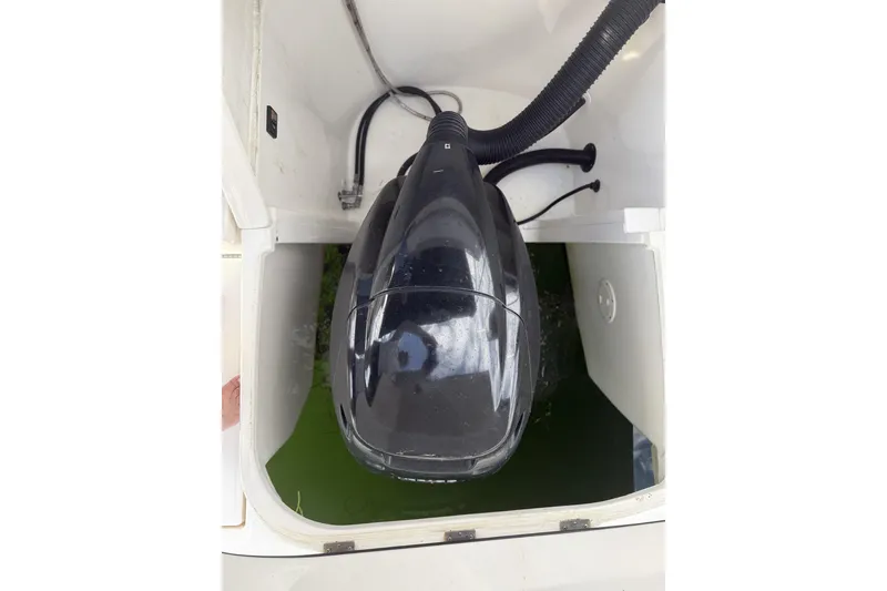 Slide: The Image of Engine compartment of a 2015 Sea Ray 370 Venture boat, featuring a black engine cover. - 12