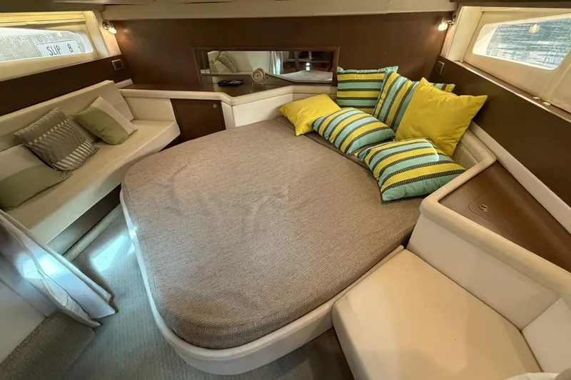 Slide: The Image of Luxurious cabin interior of 2015 Sea Ray 370 Venture with cozy bedding and stylish cushions. - 25