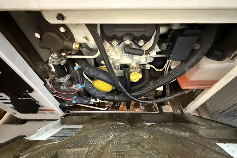 Slide: The Image of Engine compartment of a 2015 Sea Ray 370 Venture boat, showing hoses and components. - 29