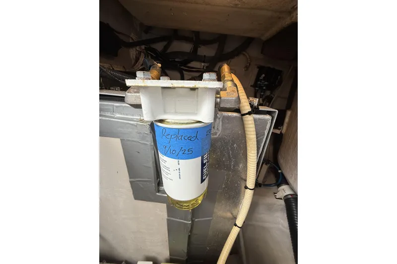 Slide: The Image of Fuel filter in 2015 Sea Ray 370 Venture engine compartment, labeled "Replaced 9/10/25". - 31