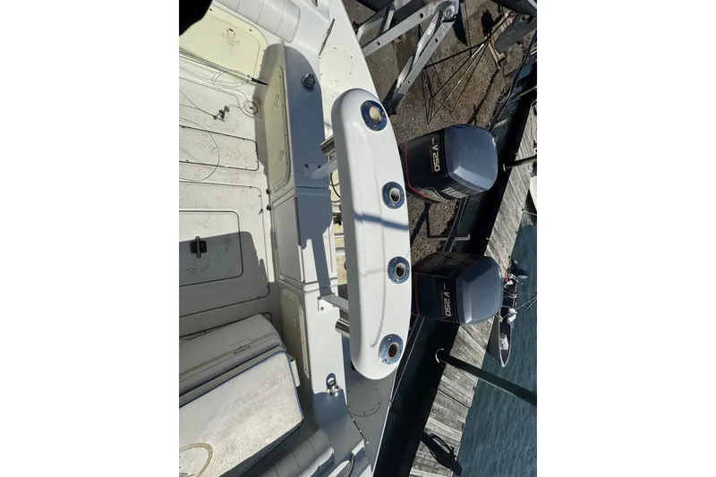 Slide: The Image of 1990 Donzi F 33 boat interior with twin V250 engines at dockside. - 14