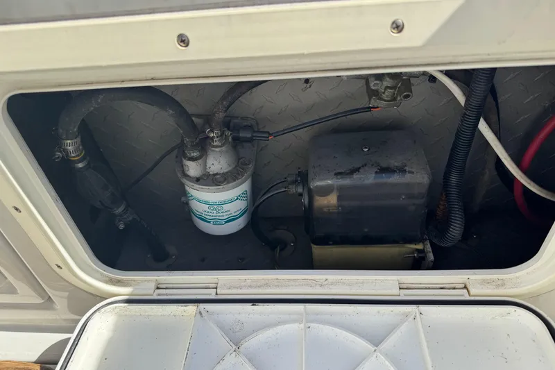 Slide: The Image of Engine compartment of a 1990 Donzi F 33 boat, showing fuel filter and wiring. - 20