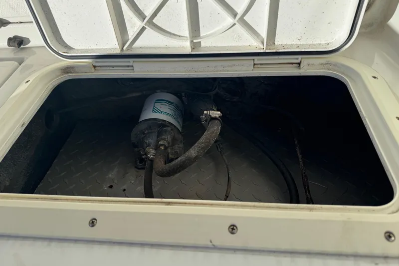 Slide: The Image of Open hatch of 1990 Donzi F 33 boat showing internal components and wiring. - 21