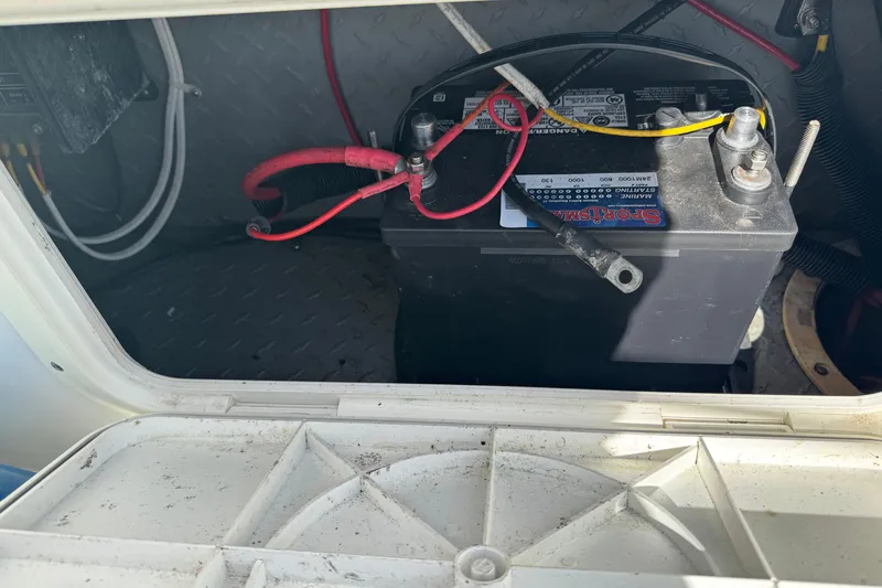 Slide: The Image of Battery compartment of a 1990 Donzi F 33 boat, showing wiring and connections. - 23
