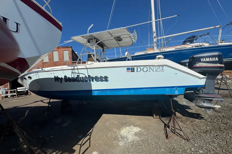 Slide: The Image of 1990 Donzi F 33 boat named "My Seaductress" on dry dock with Yamaha outboard. - 3