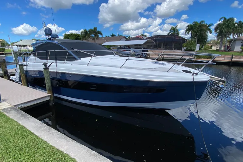 The Image of Azimut Atlantis 45 yacht, 2021 model, docked in a sunny marina setting. - 0