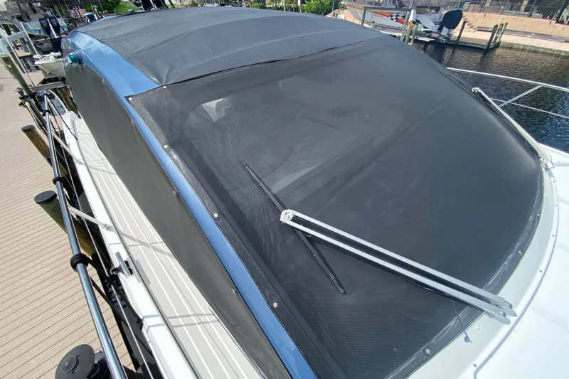 Slide: The Image of 2021 Azimut Atlantis 45 yacht with covered windshield docked at marina. - 11