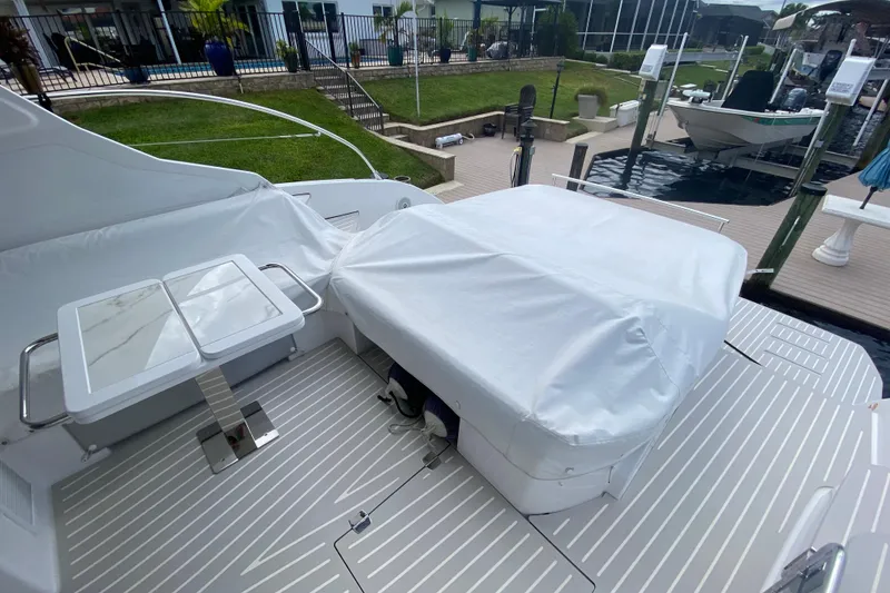 Slide: The Image of Azimut Atlantis 45 yacht deck, 2021 model, featuring covered seating and table. - 17