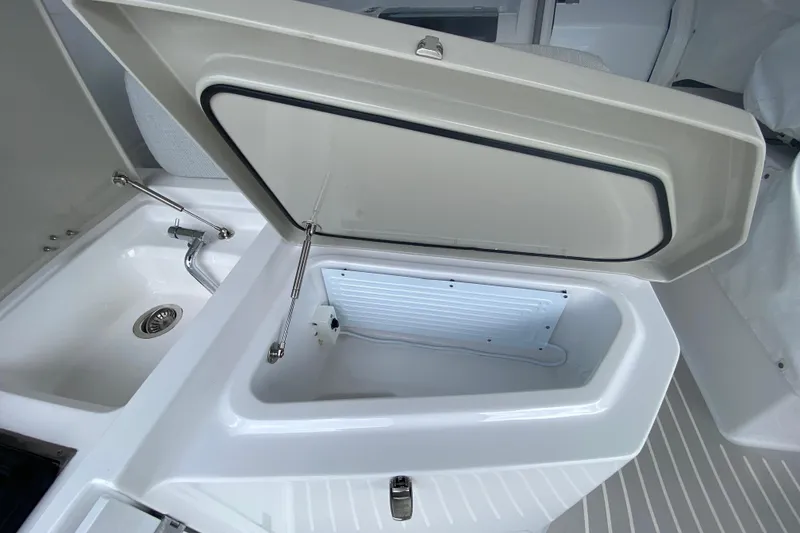 Slide: The Image of Open storage compartment and sink on 2021 Azimut Atlantis 45 yacht. - 22
