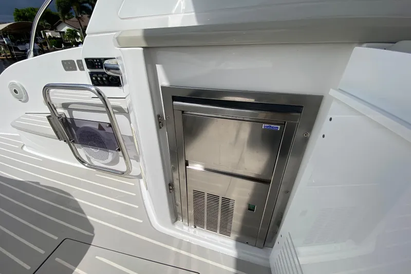 Slide: The Image of Azimut Atlantis 45 yacht interior, featuring a built-in stainless steel refrigerator, 2021 model. - 23
