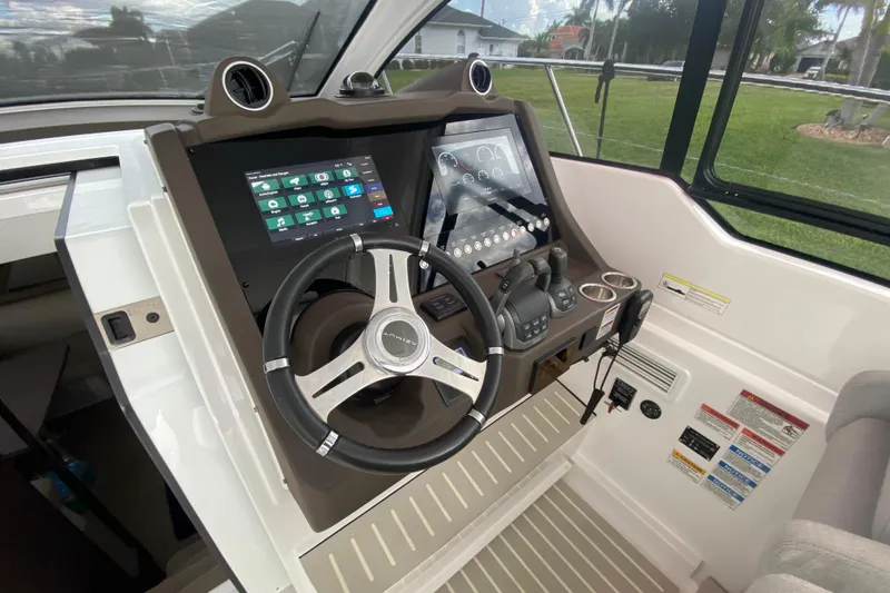 Slide: The Image of Helm of 2021 Azimut Atlantis 45 yacht with modern controls and touchscreen display. - 31