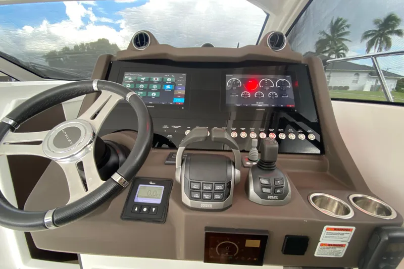 Slide: The Image of Cockpit of 2021 Azimut Atlantis 45 yacht with modern navigation controls and steering wheel. - 33