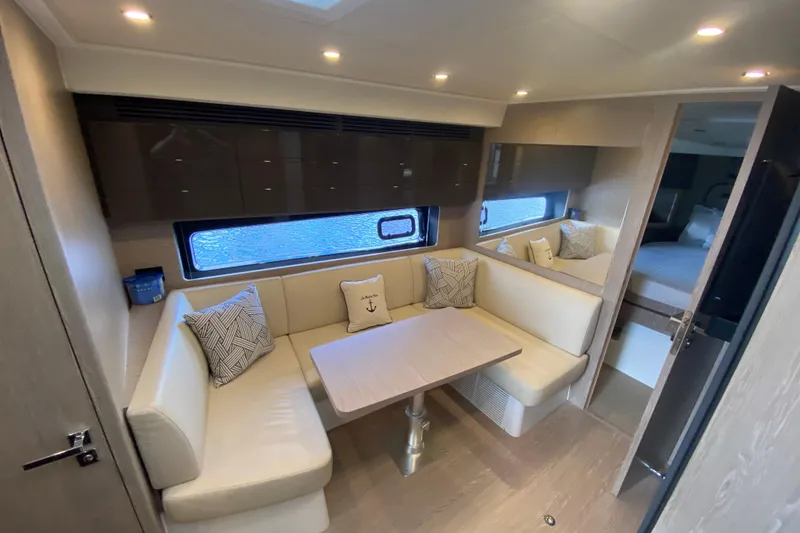 Slide: The Image of Luxurious interior of 2021 Azimut Atlantis 45 yacht with elegant seating and table. - 35