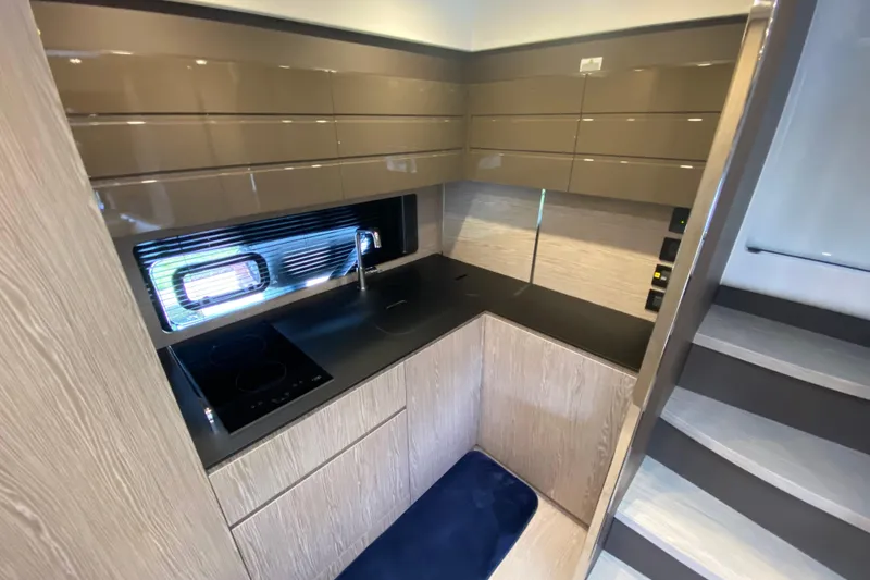 Slide: The Image of Modern kitchen interior on 2021 Azimut Atlantis 45 yacht, featuring sleek cabinetry and appliances. - 37