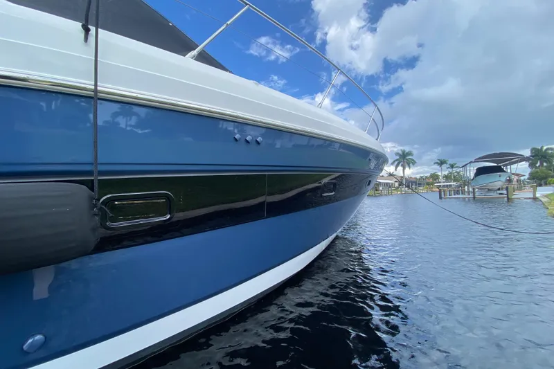 Slide: The Image of Azimut Atlantis 45 yacht, 2021 model, docked on a sunny day with blue skies. - 4