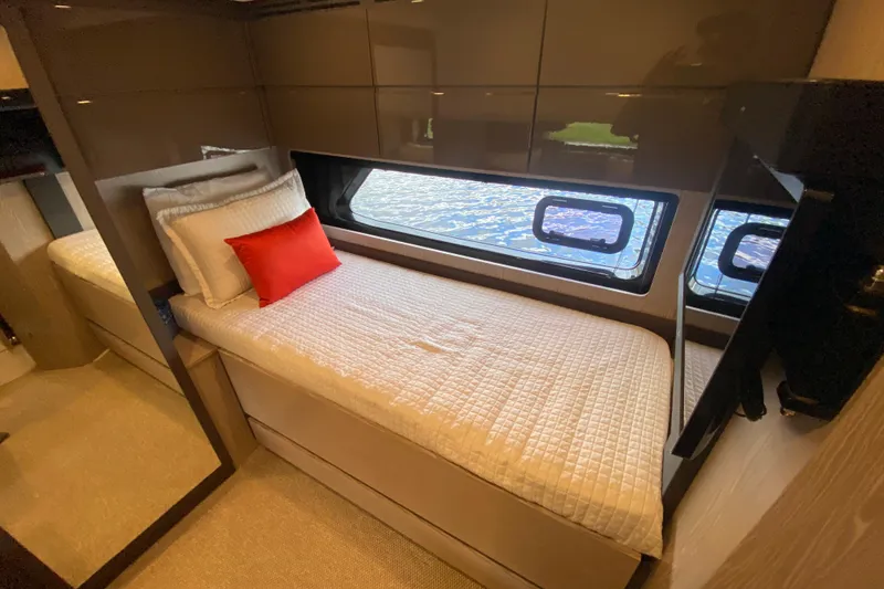 Slide: The Image of Luxurious cabin interior of 2021 Azimut Atlantis 45 yacht with single bed and window view. - 47