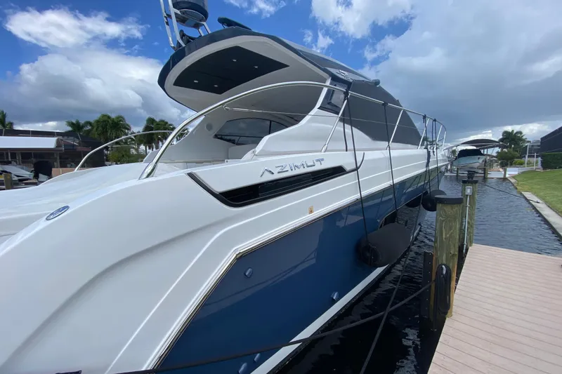 Slide: The Image of 2021 Azimut Atlantis 45 yacht docked, showcasing sleek design and modern features. - 5