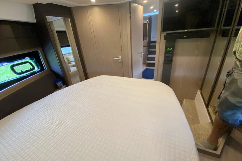 Slide: The Image of Luxurious interior of 2021 Azimut Atlantis 45 yacht bedroom with modern amenities. - 56