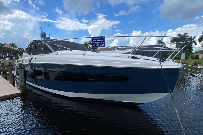 Slide: The Image of 2021 Azimut Atlantis 45 yacht docked on a sunny day, showcasing sleek design. - 6