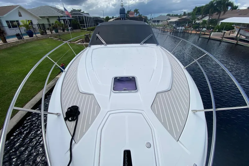 Slide: The Image of Azimut Atlantis 45 yacht, 2021 model, docked in a residential canal setting. - 8
