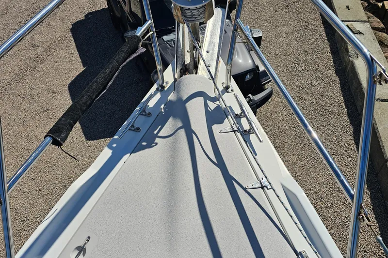 Slide: The Image of Bow view of a 2007 Catalina 350 sailboat with stainless steel railings. - 11