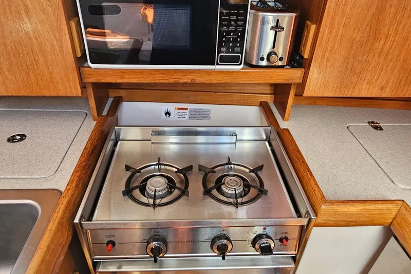 Slide: The Image of Catalina 350 yacht kitchen with stove, microwave, and toaster, 2007 model. - 19