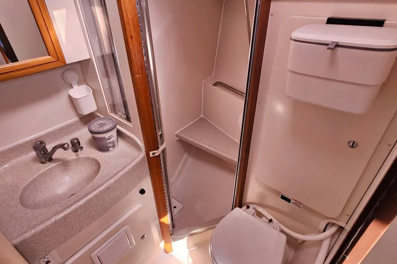 Slide: The Image of Compact bathroom in 2007 Catalina 350 sailboat with sink, shower, and toilet. - 24