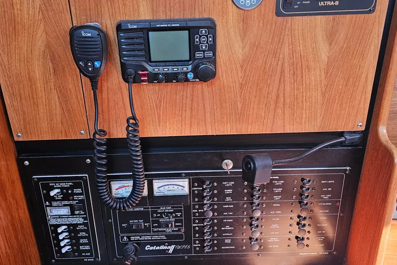 Slide: The Image of Control panel of a 2007 Catalina 350 yacht with radio and switches. - 29