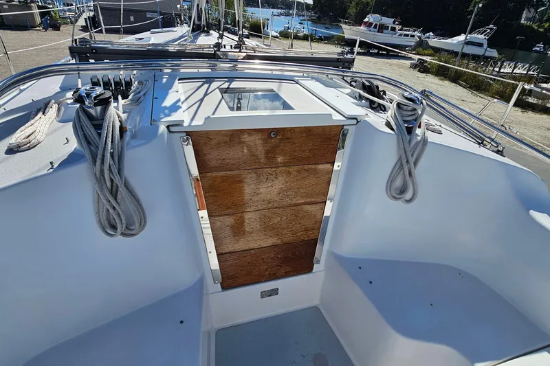 Slide: The Image of Cockpit of 2007 Catalina 350 sailboat with wooden hatch and coiled ropes. - 6