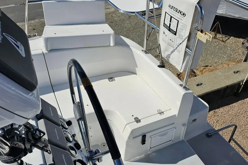 Slide: The Image of Cockpit of 2007 Catalina 350 sailboat with steering wheel and safety equipment. - 9