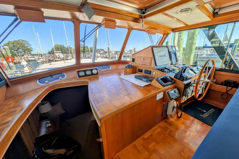 Slide: The Image of Interior of 2001 Dettling 51 yacht cockpit with navigation equipment and wooden finish. - 14