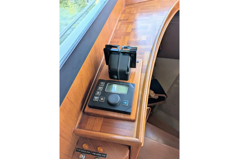 Slide: The Image of Control panel on a 2001 Dettling 51 yacht with wooden dashboard. - 16