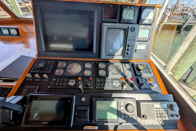 Slide: The Image of Control panel of a 2001 Dettling 51 boat with navigation and communication equipment. - 17