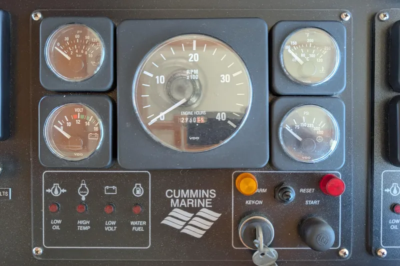 Slide: The Image of Control panel of a 2001 Dettling 51 boat with Cummins Marine gauges and indicators. - 19