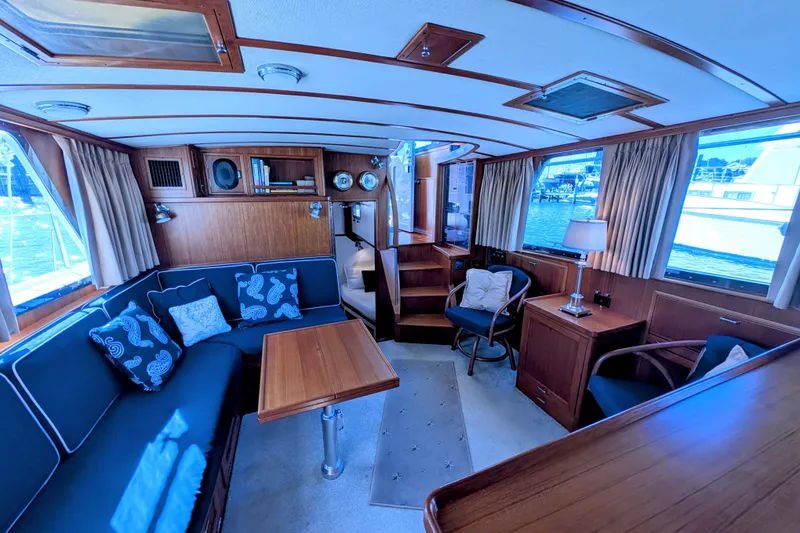 Slide: The Image of Luxurious 2001 Dettling 51 yacht interior with elegant wood finish and comfortable seating. - 24