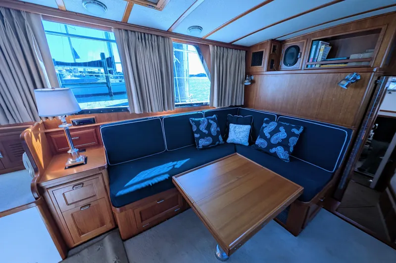 Slide: The Image of Luxurious 2001 Dettling 51 yacht interior with elegant wood finish and comfortable seating. - 25