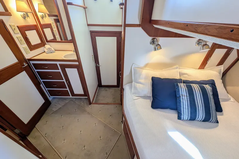 Slide: The Image of Luxurious 2001 Dettling 51 yacht interior with cozy bed and elegant bathroom. - 34