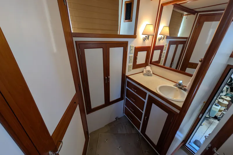 Slide: The Image of Luxurious bathroom in 2001 Dettling 51 yacht, featuring wood accents and modern fixtures. - 37
