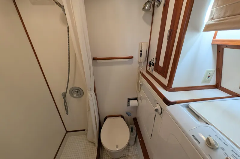 Slide: The Image of Bathroom in 2001 Dettling 51 yacht with shower, toilet, and washing machine. - 38