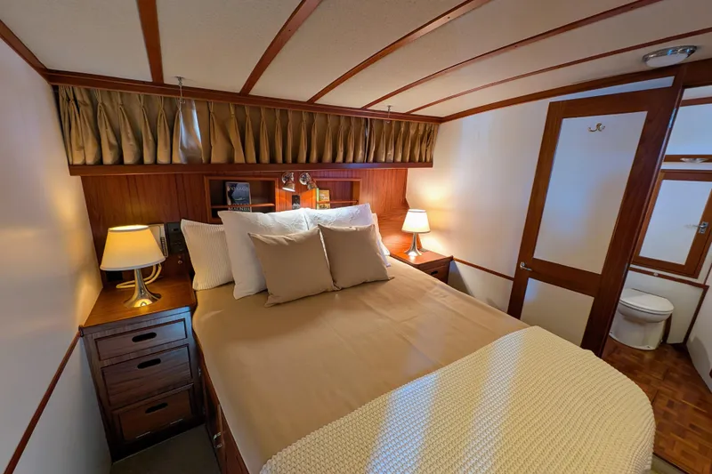Slide: The Image of Luxurious cabin interior of 2001 Dettling 51 yacht with cozy bed and elegant decor. - 40